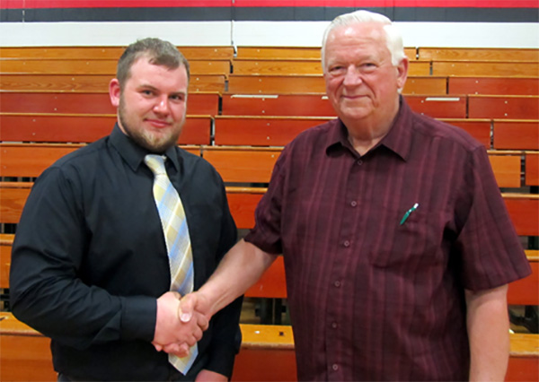 Fred Skaife, Foundation Board member, congratulates Brandon Graul, recipient of the James e. Schroeder Scholarship.
